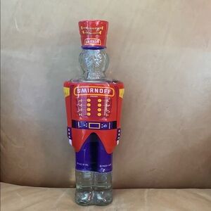 Smirnoff Vodka Bottle with Decorative Cover
Bottle has not been open 
Date 1998